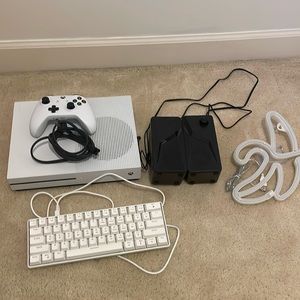Xbox Series X w/ controller, 2 loud speakers, an LED keyboard and and LED Baanna